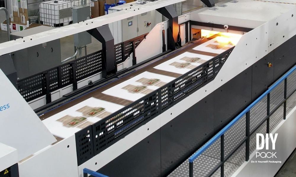 DIYpack digital corrugated printing press producing custom packaging boxes in the USA.